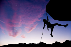 silhouette of a climber at twilight