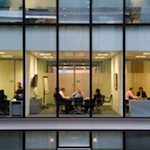 Meeting in glass office block