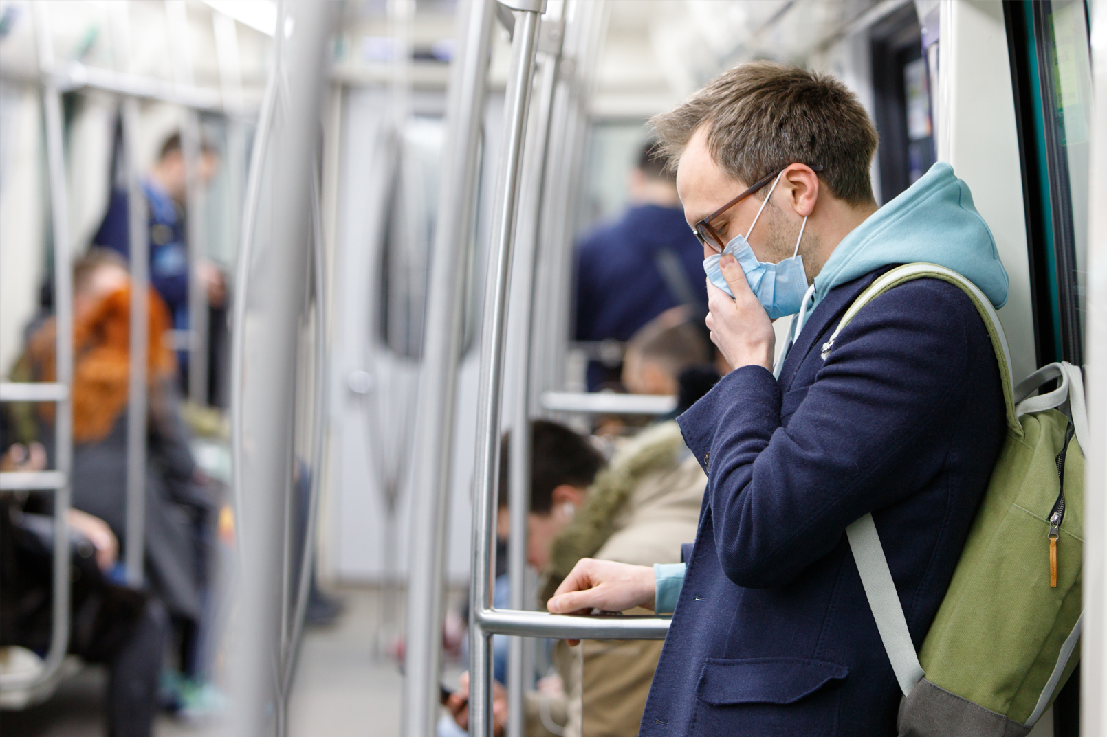 Man in a mask on public transport